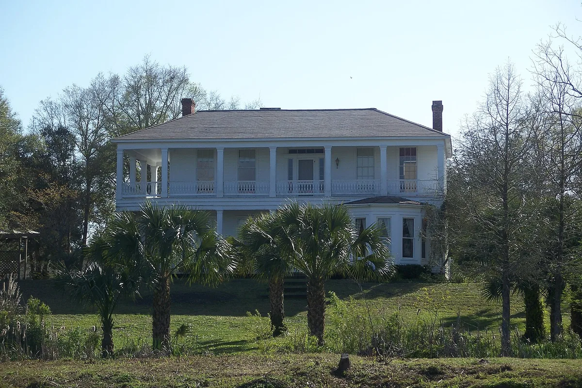 The white two-story Orman House with porches in Apalachicola