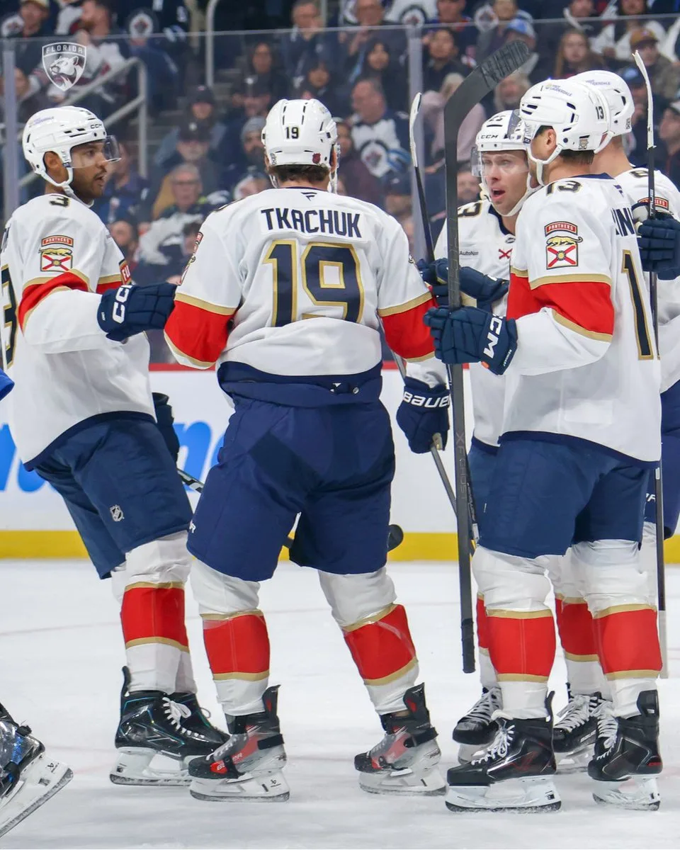 Florida Panthers players celebrate a goal against the Winnipeg Jets