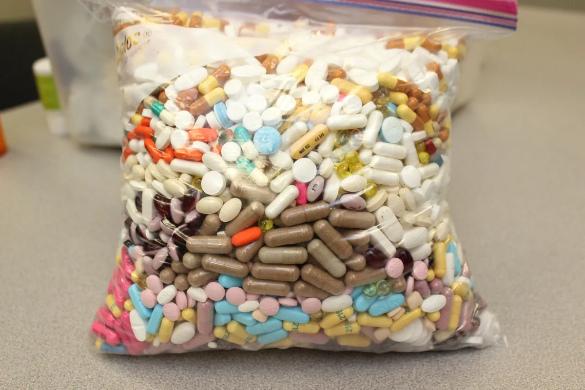 A clear bag filled with pills and capsules collected at the take back event